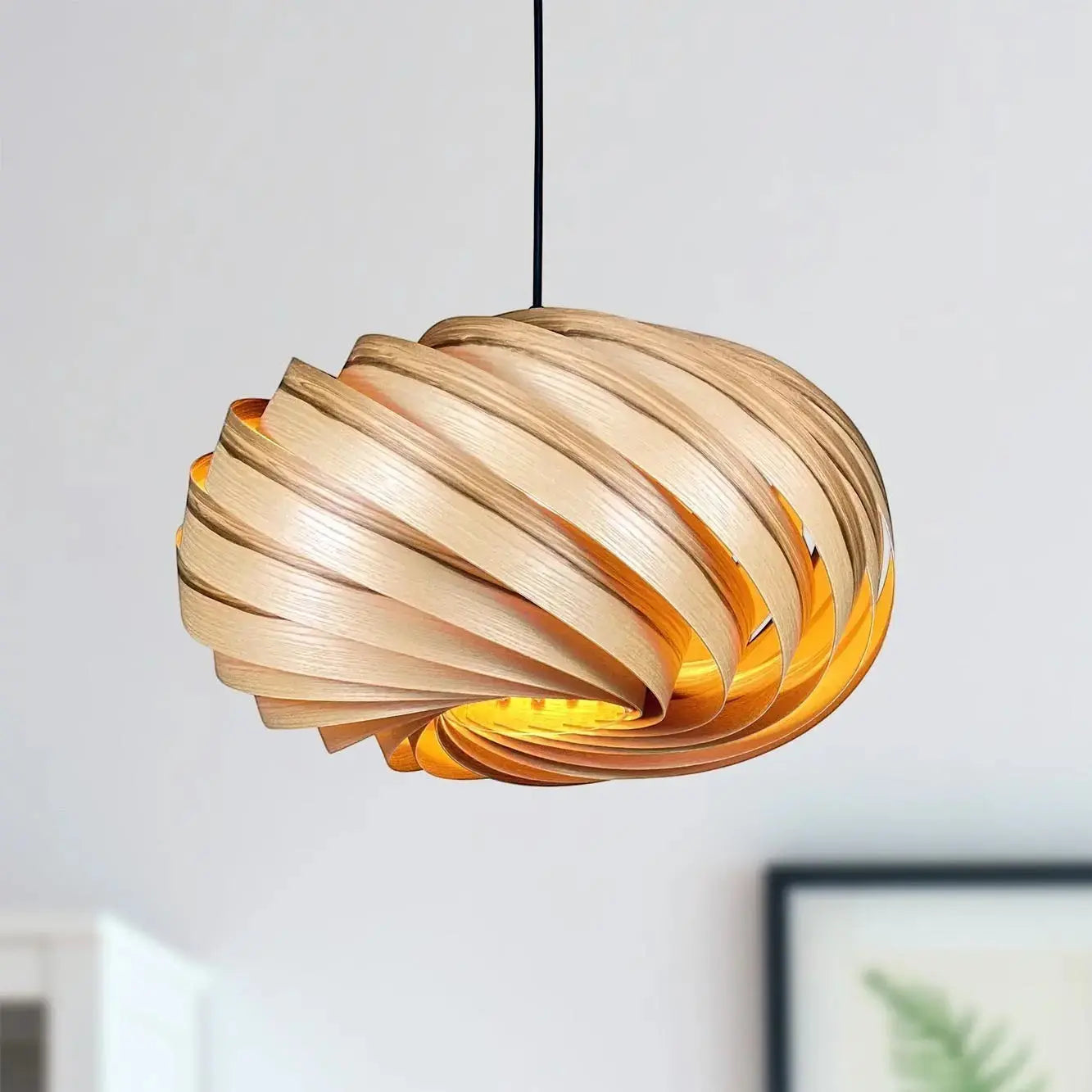 Gofurnit Quiescenta pendant lamp shade made of olive ash wood with a swirling design, 45cm diameter, handcrafted in Germany.