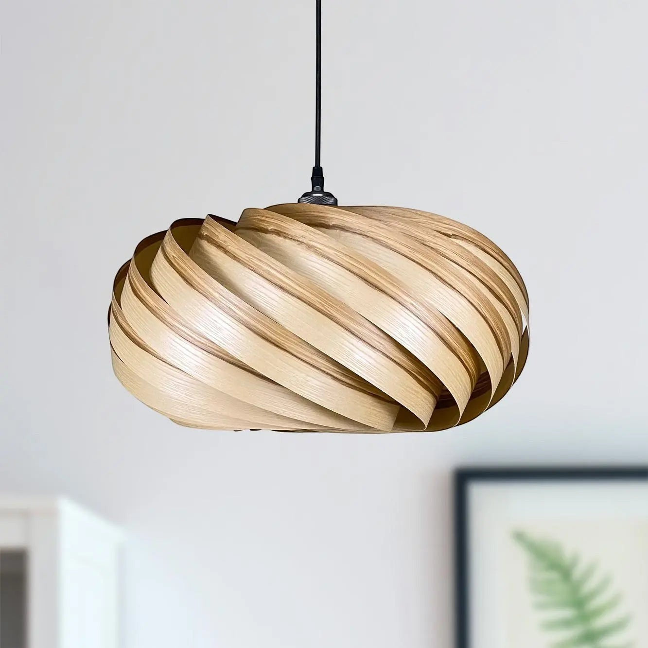 Gofurnit Quiescenta pendant lampshade made of olive ash wood with a unique swirling design, 45cm diameter.